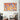 Vibrant orange and blue abstract art canvas on modern living room wall, featuring bold marbled patterns.