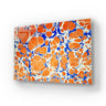Bespoke decorative glass panel with vibrant orange and blue marbled pattern, ideal for luxury interiors.