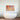 Bespoke decorative glass wall art with orange and blue marbled pattern above modern bathtub