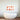 Abstract terracotta art print above modern freestanding bathtub in luxury bathroom