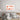 Abstract terracotta wall art above modern bed in minimalist bedroom decor