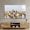 Large wall art print of white horses in water, modern living room decor with wooden media unit