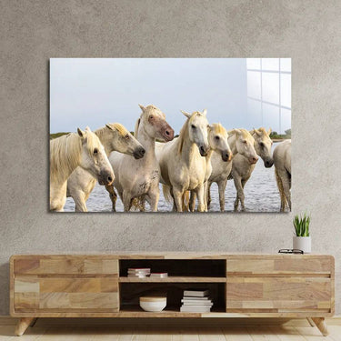 Large wall art print of white horses in water, modern living room decor with wooden media unit