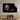 Black and white lion roar wall art above wooden TV unit in modern living room