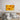 Vibrant yellow musical instruments wall art above modern bed, decorative glass panel for bedroom decor
