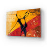 Abstract glass art panel with black figures on warm yellow and red background, ideal for modern interiors.
