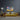Abstract art canvas on dark wall above yellow sofa in modern living room