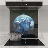 Bespoke glass kitchen splashback with Earth image, modern induction hob, and stainless steel pot