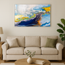 Abstract galaxy wall art with blue, yellow, and white swirls above beige sofa in modern living room
