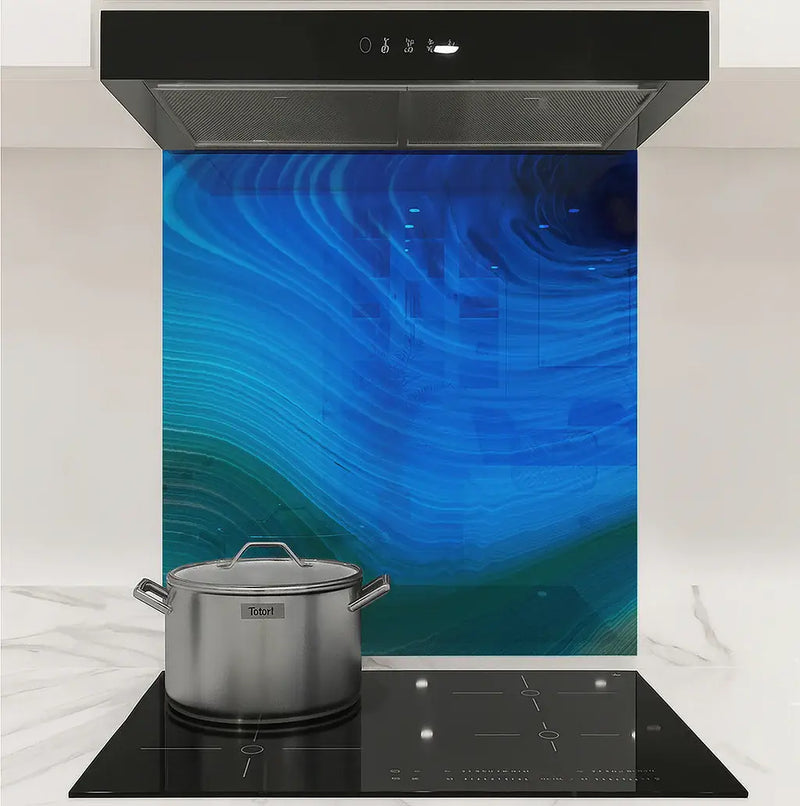 Modern kitchen stove with stainless steel pot and blue agate stone backsplash under stainless steel hood