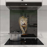 Bespoke kitchen glass splashback featuring a vivid leopard design, enhancing modern luxury interiors.