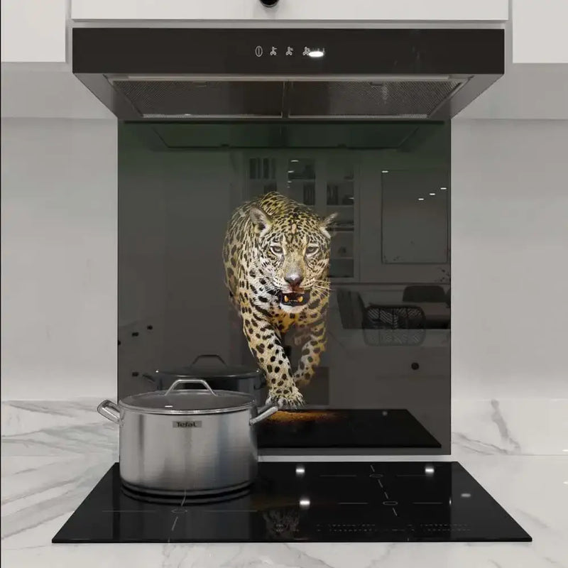 Bespoke kitchen glass splashback featuring a vivid leopard design, enhancing modern luxury interiors.