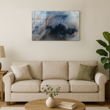 Modern beige sofa with green and beige pillows in living room featuring abstract wall art and round wooden coffee table