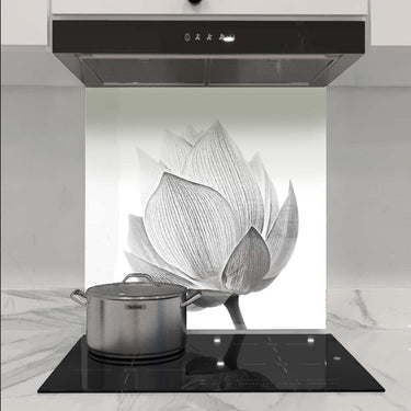 Bespoke floral glass splashback in modern kitchen with induction hob and extractor hood