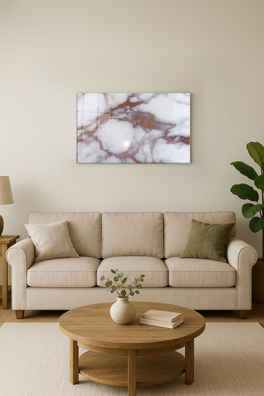 Modern living room with beige sofa, wooden coffee table, marble wall art with rose gold veins, and indoor plant