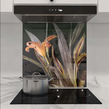 Bespoke floral glass splashback in modern kitchen with induction hob and extractor hood