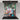 Vibrant floral face art glass splashback in modern kitchen, bespoke decorative glass feature
