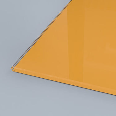 Vibrant orange architectural glass panel with sleek edge detail, ideal for modern interiors and bespoke designs.