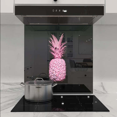 Pink pineapple decorative glass splashback in modern kitchen with induction hob