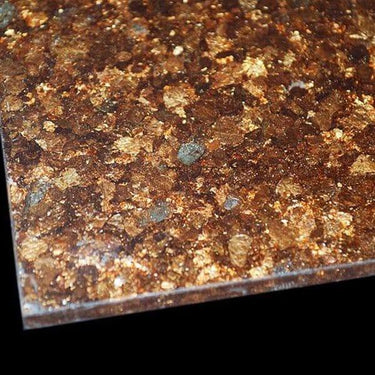 Luxury decorative glass with embedded gold flakes and textured finish for bespoke architectural projects