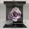 Purple rose printed glass splashback in modern kitchen with induction hob