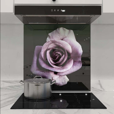 Purple rose printed glass splashback in modern kitchen with induction hob