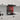Red LED backlit glass splashback in modern white kitchen with marble countertop