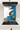 Modern kitchen cooktop with stainless steel pot and abstract blue and gold glass backsplash