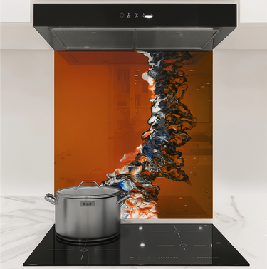 Modern kitchen stovetop with stainless steel pot and abstract orange-black glass backsplash panel