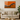 Modern living room with beige sofa, round wooden coffee table, and abstract orange and black wall art