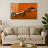 Modern living room with beige sofa, round wooden coffee table, and abstract orange and black wall art