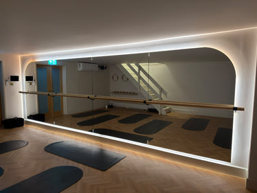 Finished LED halo mirror wall at Studio Glide Pilates in Oxted