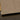 Close-up of sleek, polished glass edge with black backing, ideal for modern architectural glass installations.