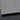 Close-up of sleek, polished glass edge with black border, ideal for modern balustrades or decorative panels.