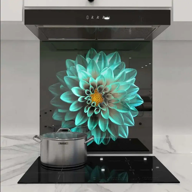 Custom kitchen glass splashback with turquoise floral design, modern cooktop and hood