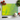 Vibrant yellow and green swirl glass chopping board with chef knife, tomatoes, garlic, and basil