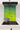 Modern kitchen cooktop with stainless steel pot and green-yellow swirling vortex backsplash