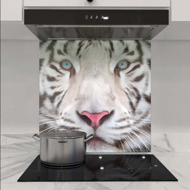White tiger face printed on kitchen glass splashback behind induction hob