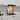 Vibrant abstract face artwork on custom kitchen glass splashback, modern white cabinetry, marble countertop