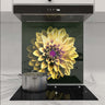 Bespoke kitchen glass splashback with vibrant yellow flower design, modern induction hob, sleek extractor hood