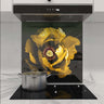 Custom kitchen glass splashback with vibrant yellow flower design, modern induction hob and marble countertop