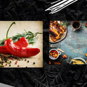 Red chili peppers, rosemary, spices on wood; roasted chicken, pumpkin, corn on rustic table