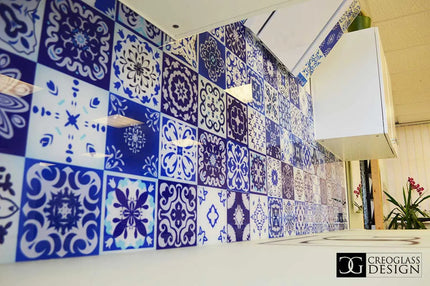 Bespoke decorative glass wall with blue and white patterned tiles for commercial interiors