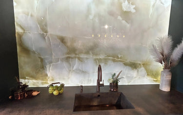 Bespoke glass splashback with marble effect, modern kitchen sink, and stylish decor accents