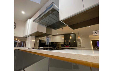 Bronze mirror glass splashback in a kitchen