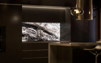 Luxury kitchen with bespoke marble-effect glass splashback and modern fixtures