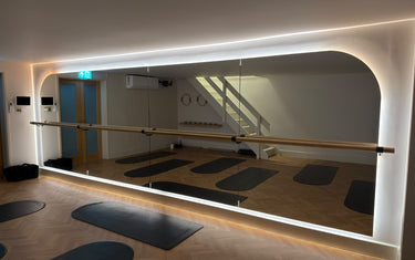 Finished LED halo mirror wall at Studio Glide Pilates in Oxted