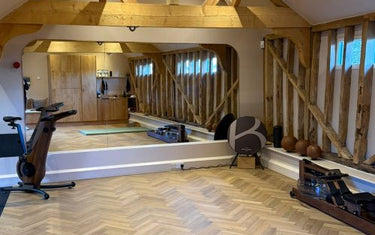 Made-to-measure gym mirror wall installed at The Byre private training studio near Guildford