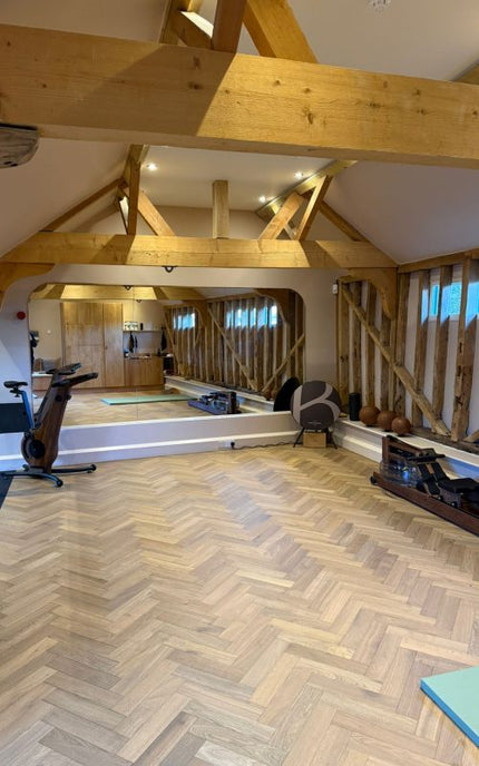 Made-to-measure gym mirror wall installed at The Byre private training studio near Guildford