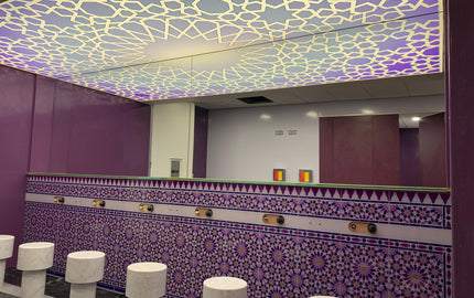 Bespoke decorative glass ceiling with geometric pattern and purple mosaic tile wall in luxury interior